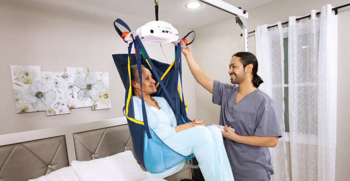 Woman being lifted in a Prism Medical FST 300