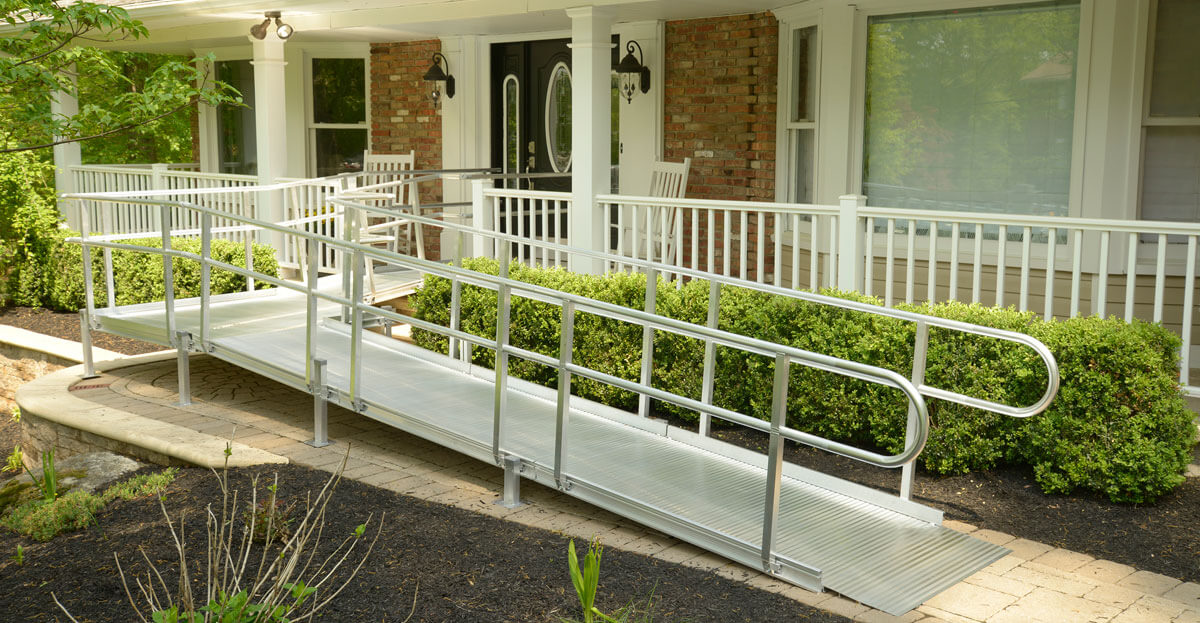 Wheelchair ramp outside front door of home