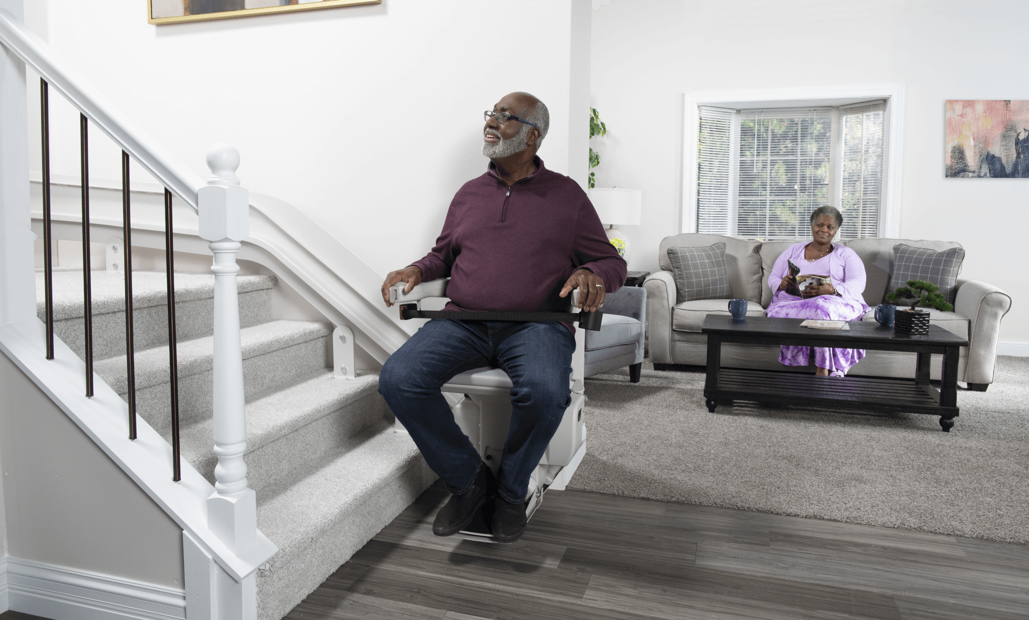 A man using the Bruno Elite Curved Stairlift