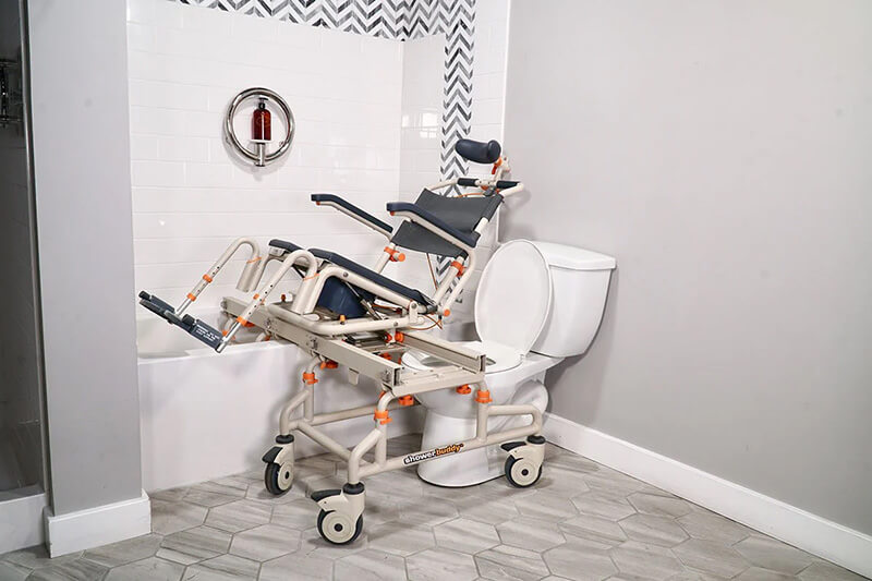 shower chair being lifted over bathtub with supporting frame