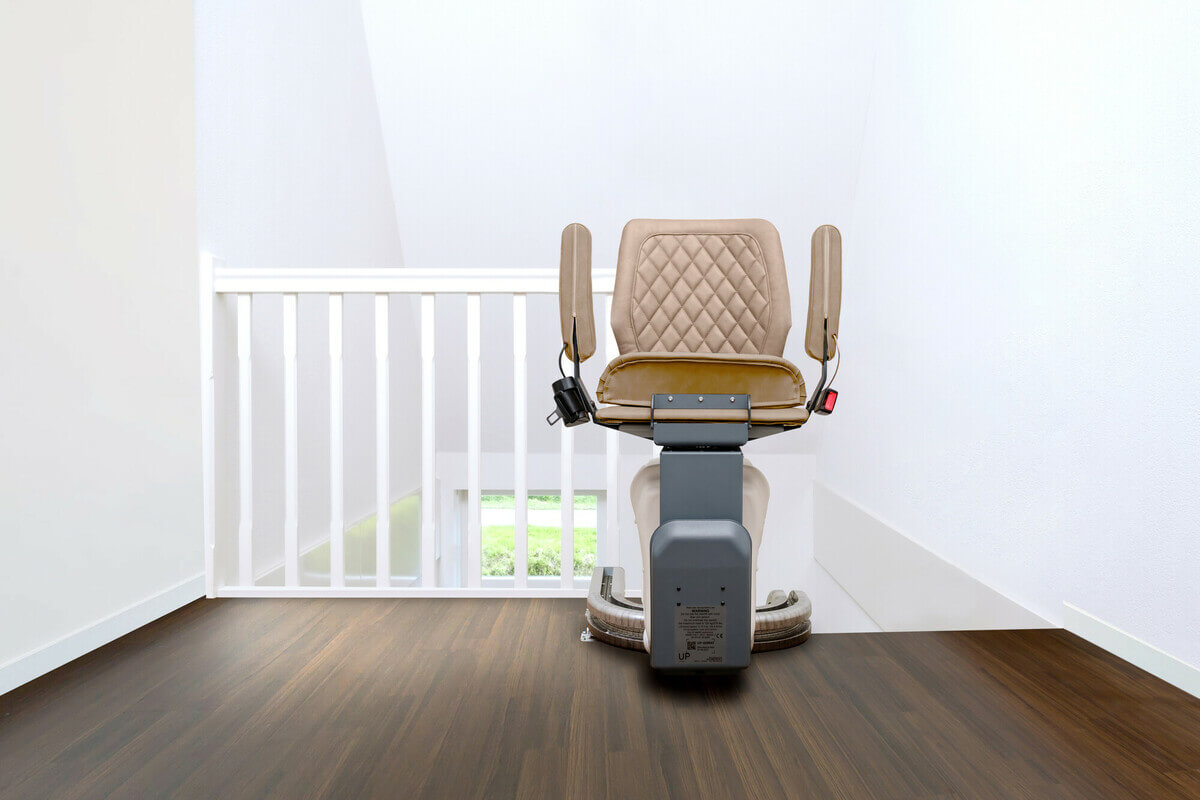 Harmar UP Stairlift at top of stairs with arms folded up