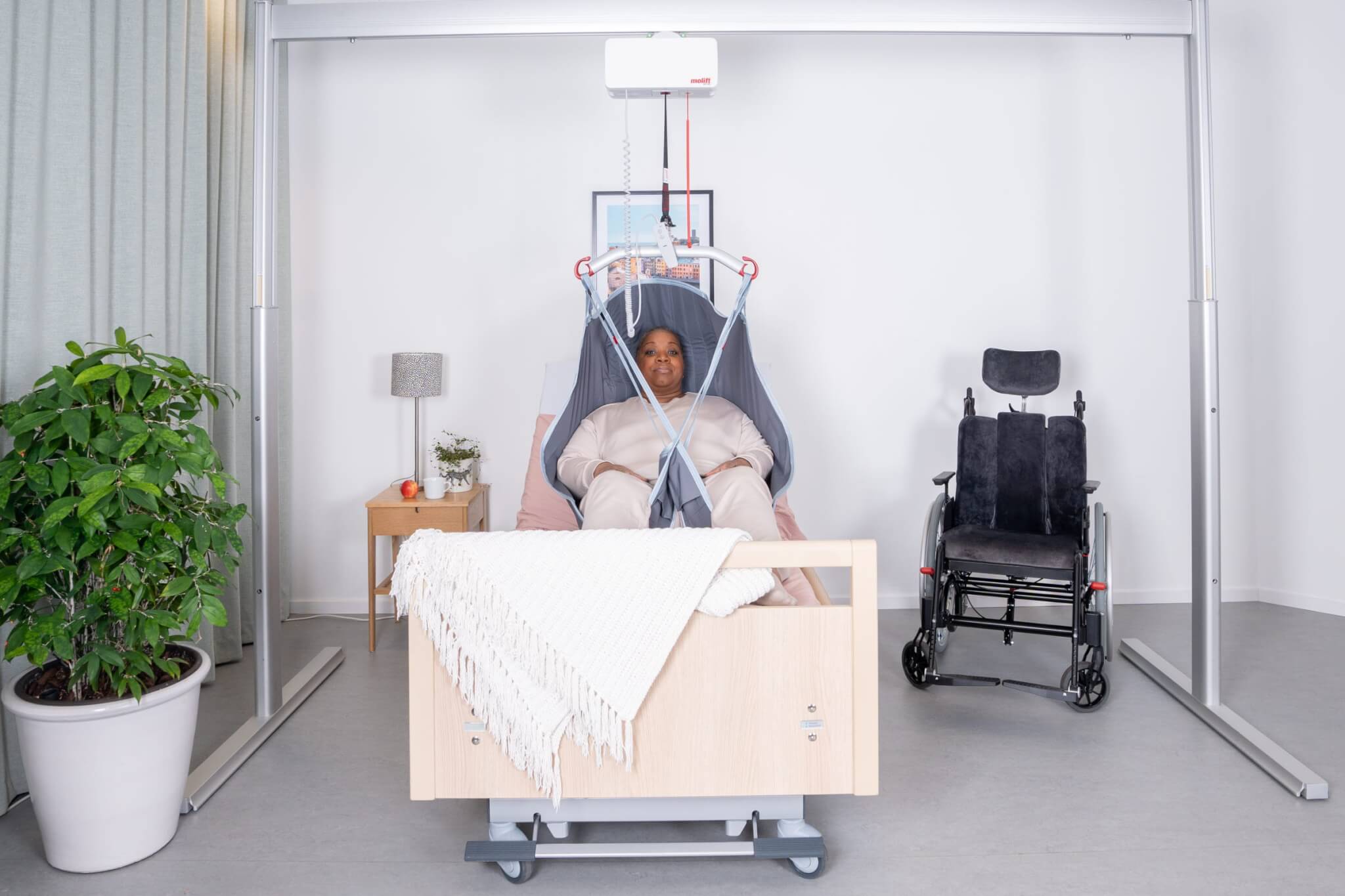 portable ceiling lift with patient